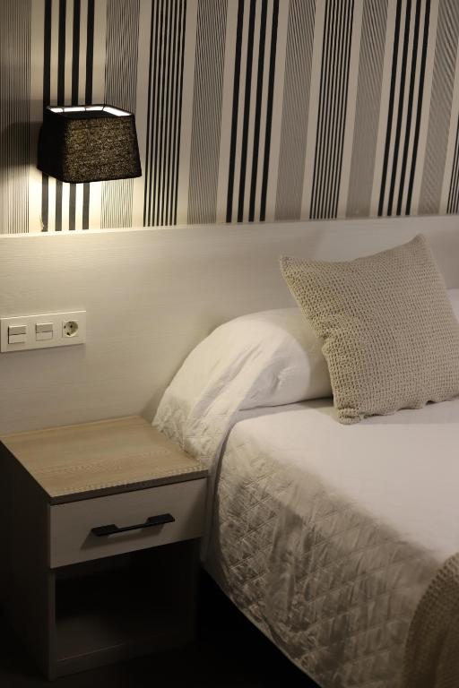 Postel nebo postele na pokoji v ubytování New Hotel Colon