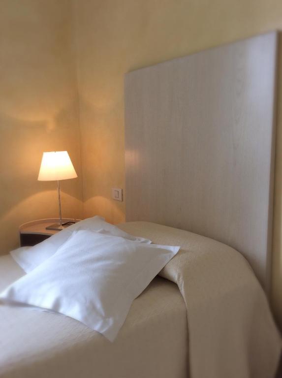 Postel nebo postele na pokoji v ubytování Hotel Colombia