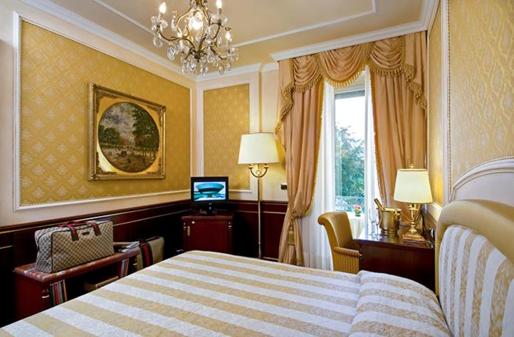 Postel nebo postele na pokoji v ubytování Grand Hotel Bristol
