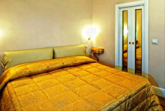 Postel nebo postele na pokoji v ubytování Boutique Hotel L'Imperatrice