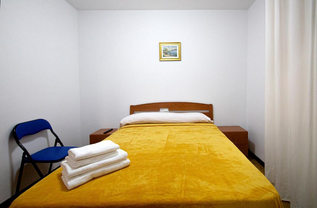Postel nebo postele na pokoji v ubytování Yani's Hospedaje Pension 1 estrella