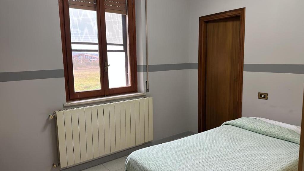 Postel nebo postele na pokoji v ubytování Hotel Paradiso