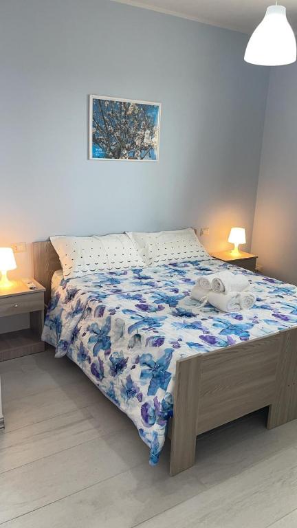 Postel nebo postele na pokoji v ubytování Leverblu House