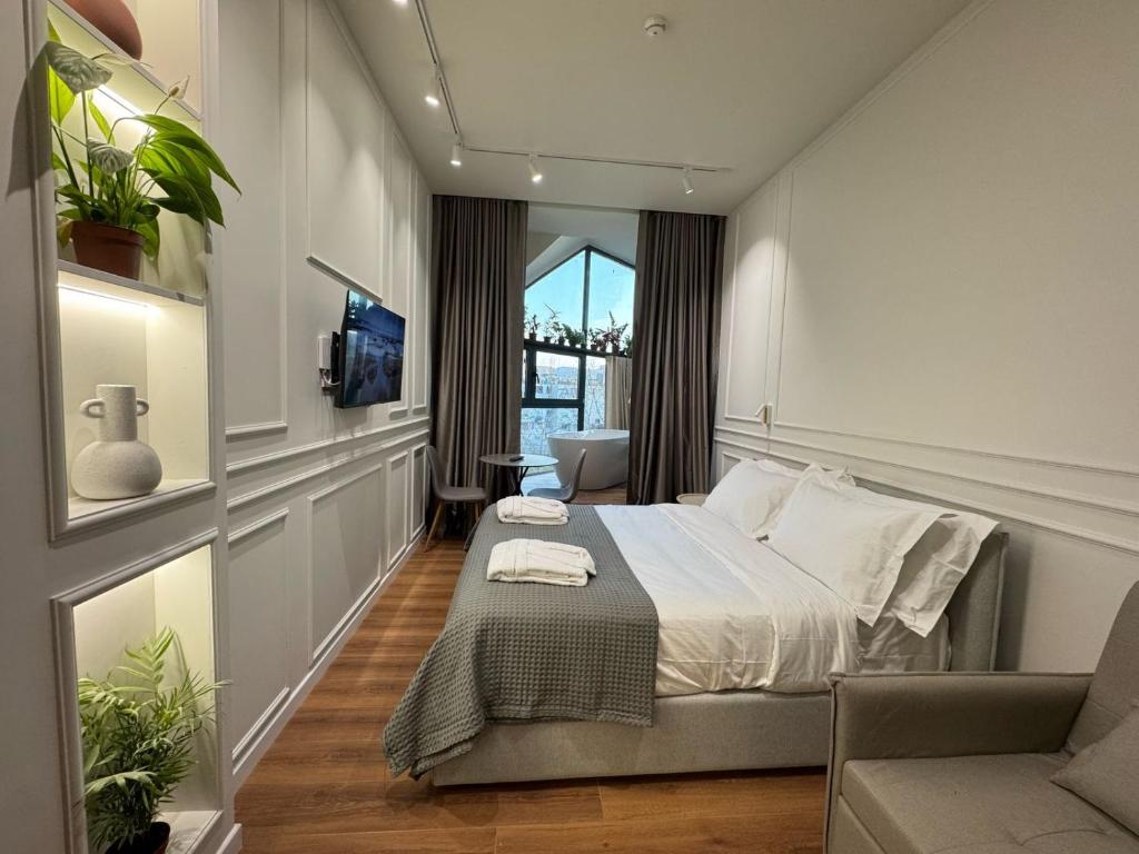Postel nebo postele na pokoji v ubytování Moonlight Apartments Tirana