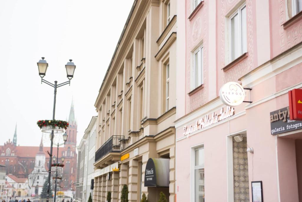 a row of buildings on a city street at Apartament Ratuszowy in Białystok