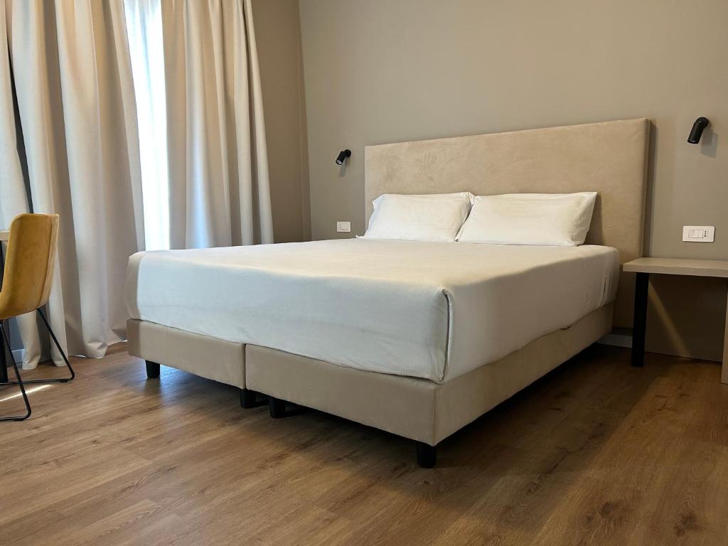 Voodi või voodid majutusasutuse Hotel Pomara toas