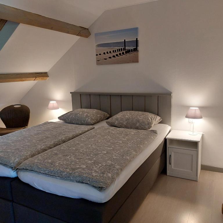 Postel nebo postele na pokoji v ubytování B&B Bouwmanshoeve