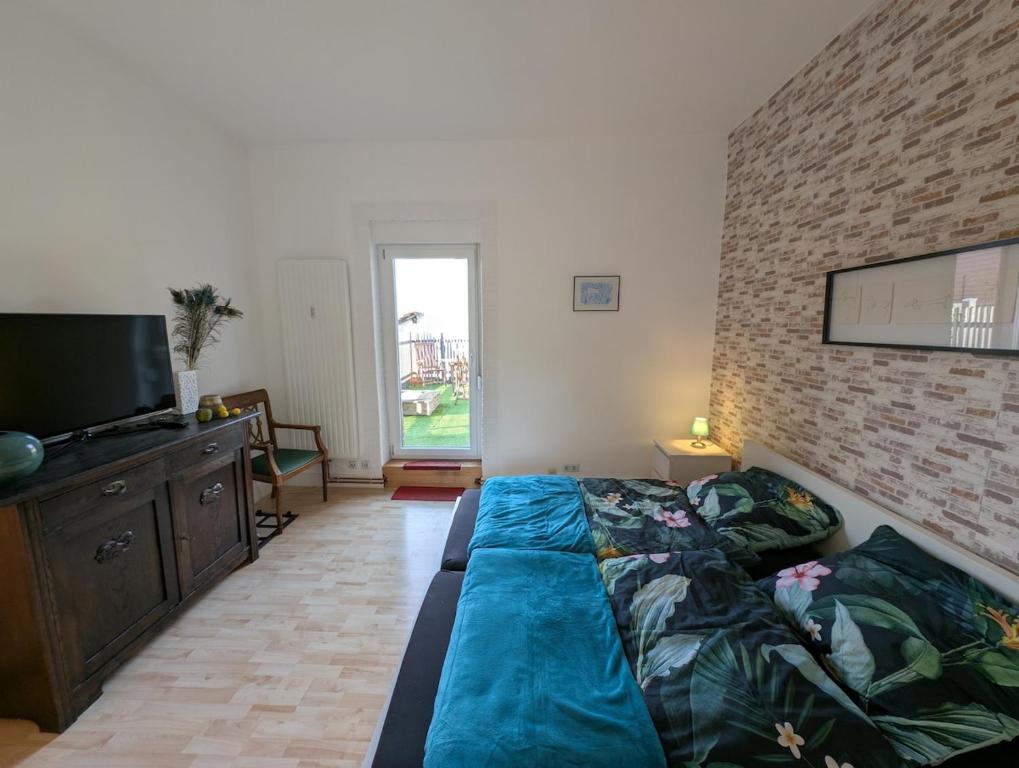 Katil atau katil-katil dalam bilik di zentrale helle Wohnung in Gau-Algesheim mit Balkon