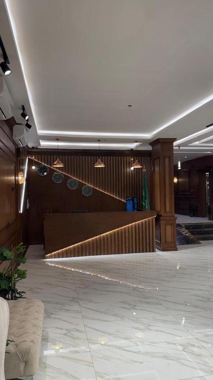 a lobby with a staircase in a building at Alula Oasis1 in AlUla