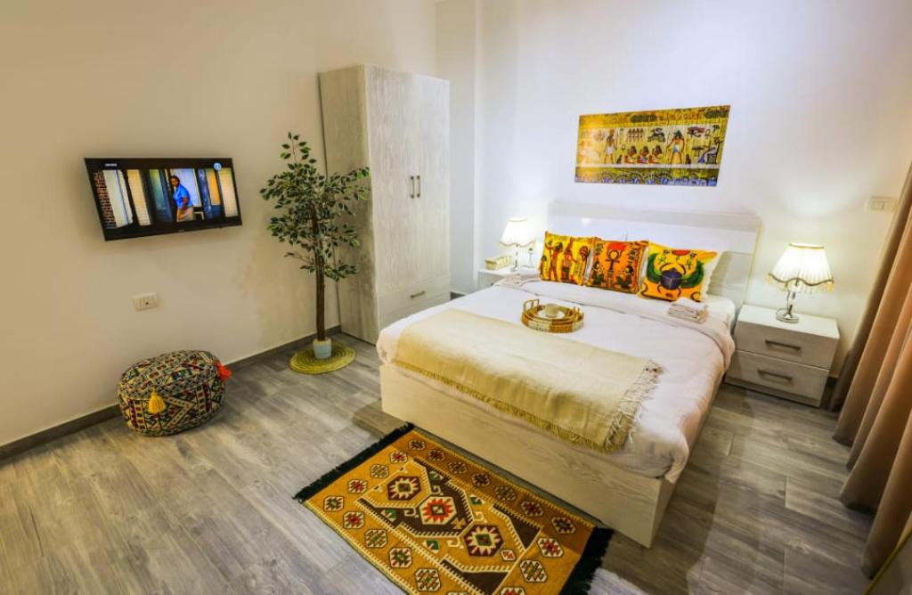 Ένα ή περισσότερα κρεβάτια σε δωμάτιο στο Imperial Resort Hurghada