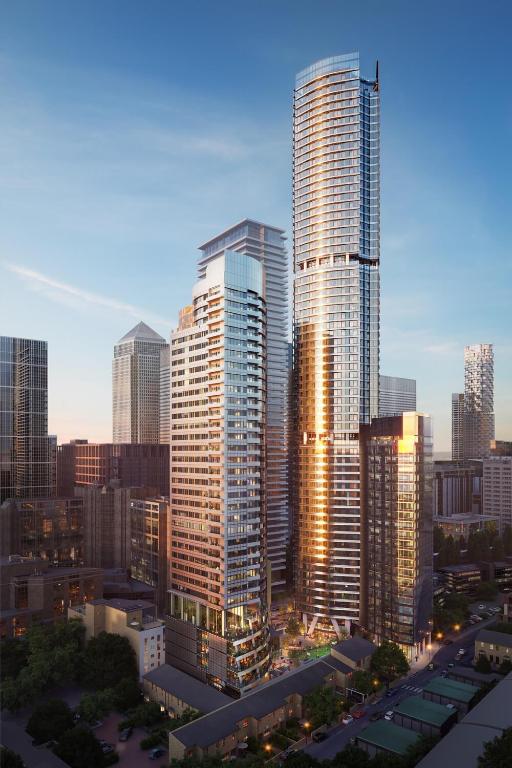 a group of tall buildings in a city at Dorsett Hotel Canary Wharf in London