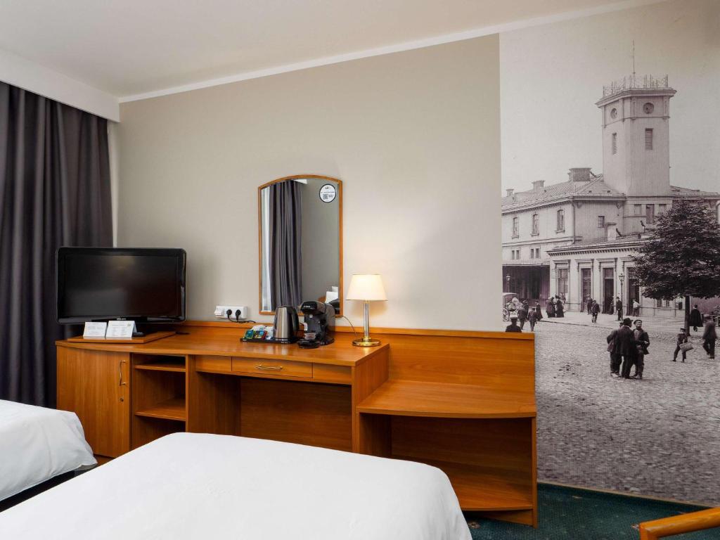Televízia a/alebo spoločenská miestnosť v ubytovaní Mercure Czestochowa Centrum