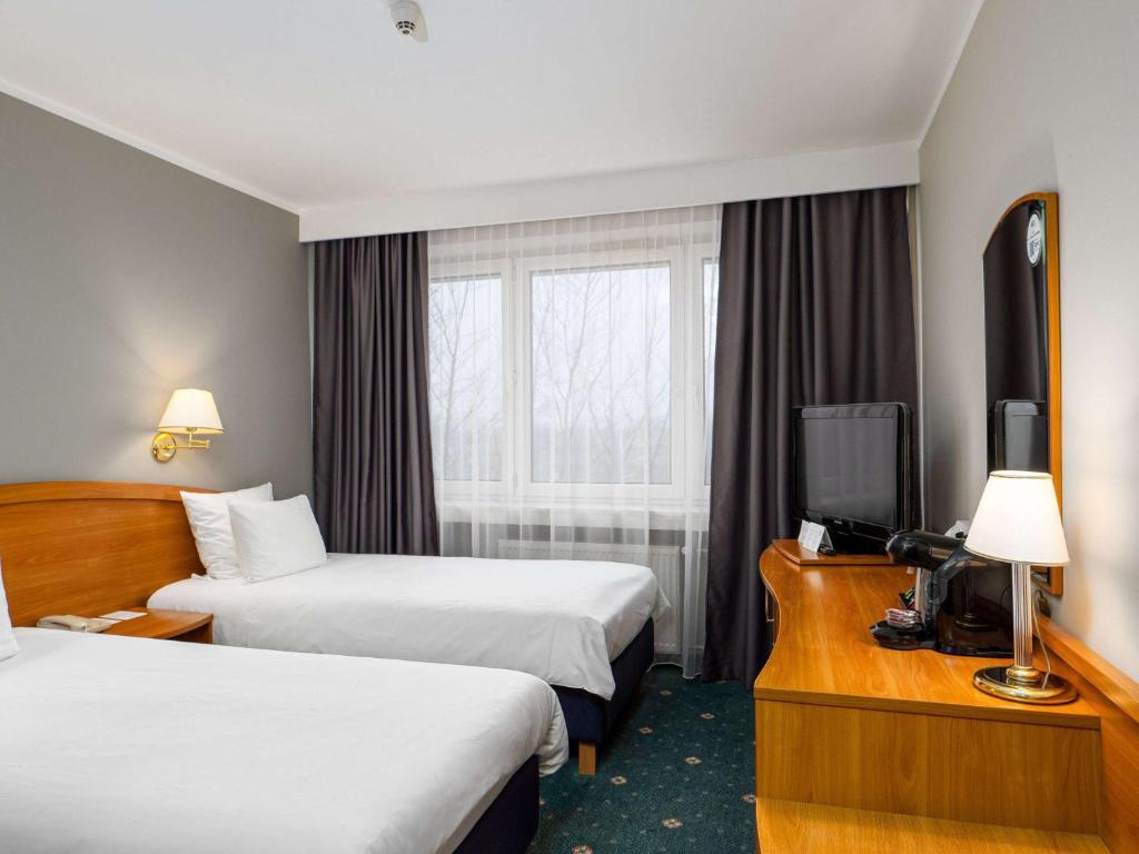 Posteľ alebo postele v izbe v ubytovaní Mercure Czestochowa Centrum