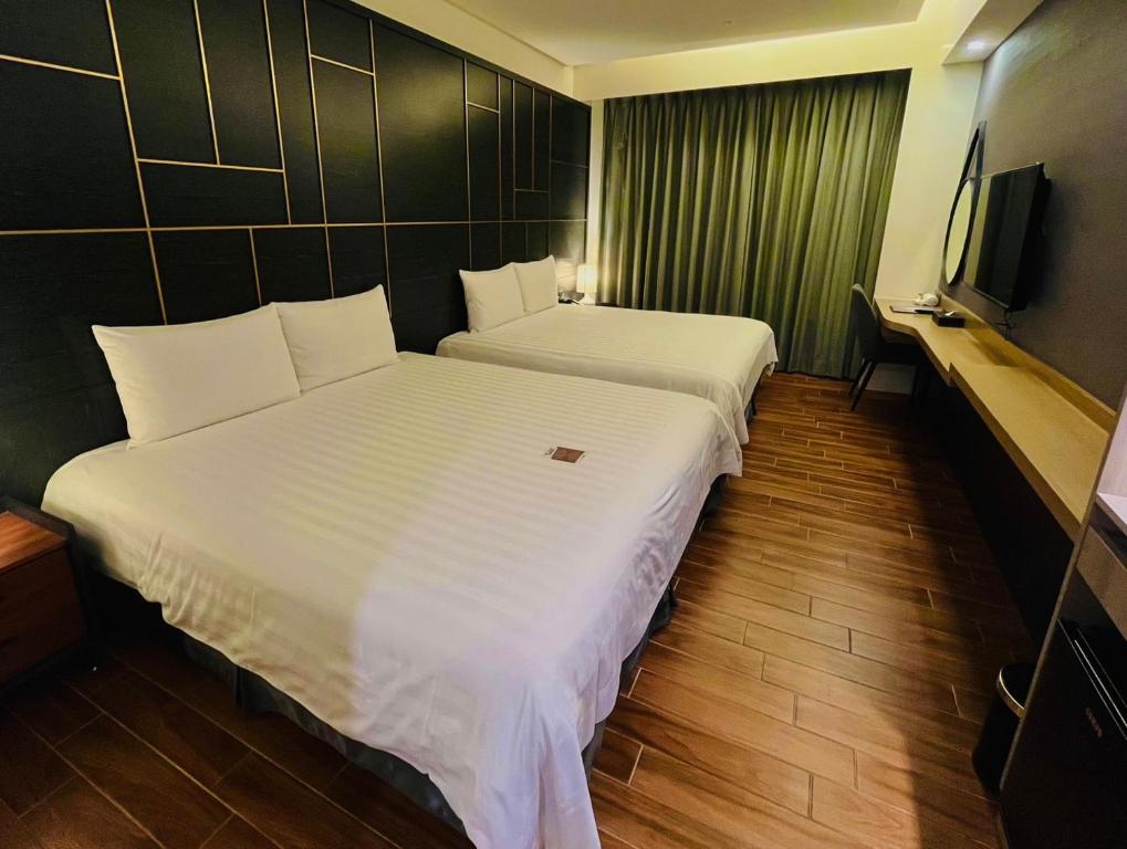 Hotel A 聖禾大飯店房間的床