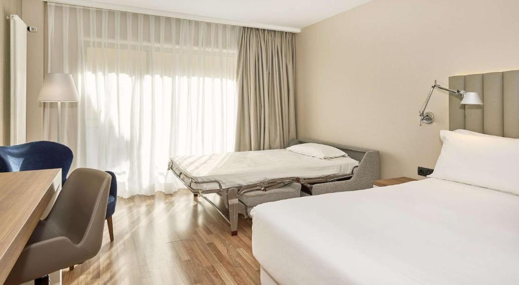 Postel nebo postele na pokoji v ubytování NH Andorra la Vella