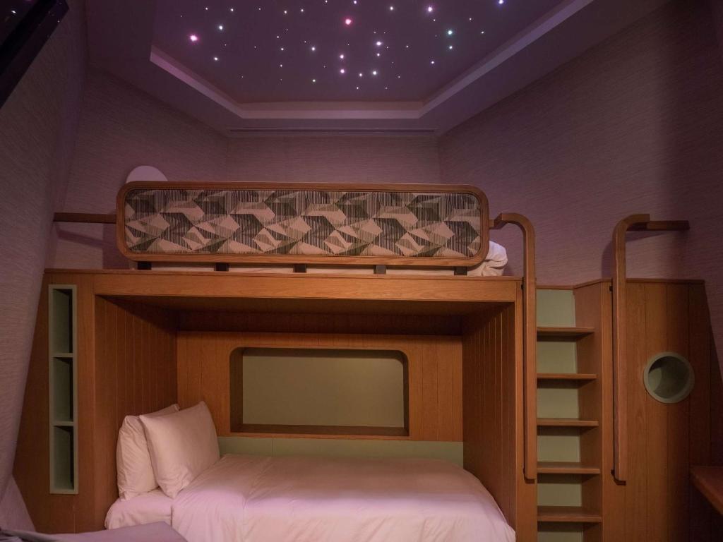 Postel nebo postele na pokoji v ubytování SO/ Maldives