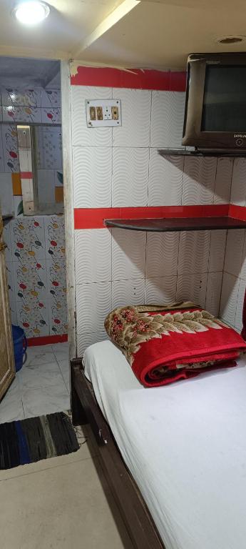 Postel nebo postele na pokoji v ubytování Taiba Guest House - BUDGET&BASIC ROOMS - Near New Market, Esplanade, Dharamatala