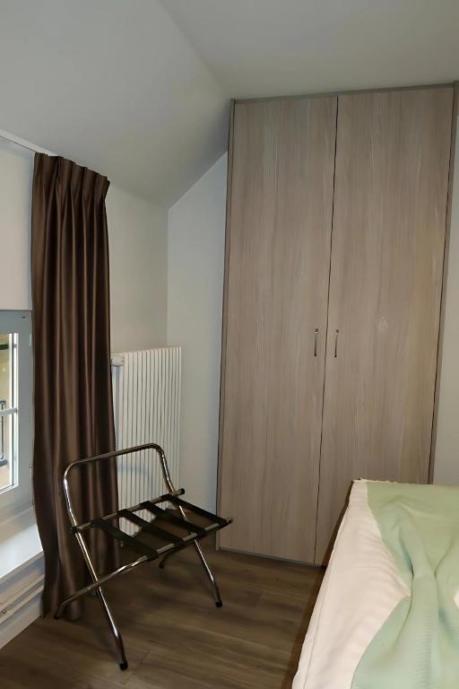 Postel nebo postele na pokoji v ubytování Hôtel de l'Ecluse