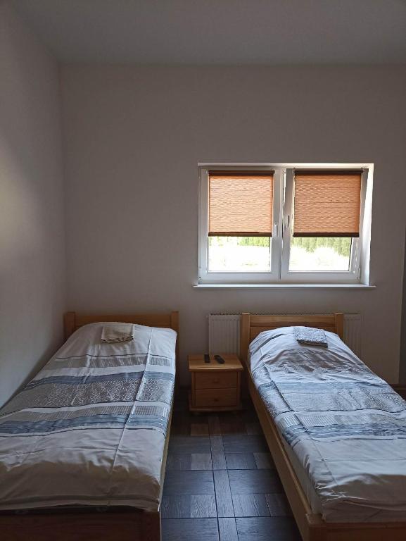Postel nebo postele na pokoji v ubytování Gospodarstwo Agroturystyczne Irena Naruszewicz