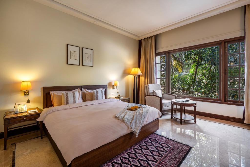 Postel nebo postele na pokoji v ubytování Sliceinn Gulmohar- Near Kempegowda International Airport, Bengaluru