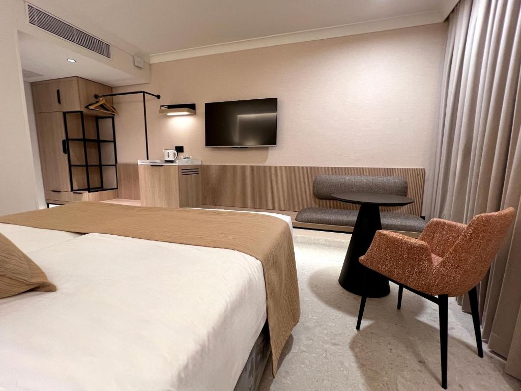 TV a/nebo společenská místnost v ubytování Caesar Premier Jerusalem Hotel