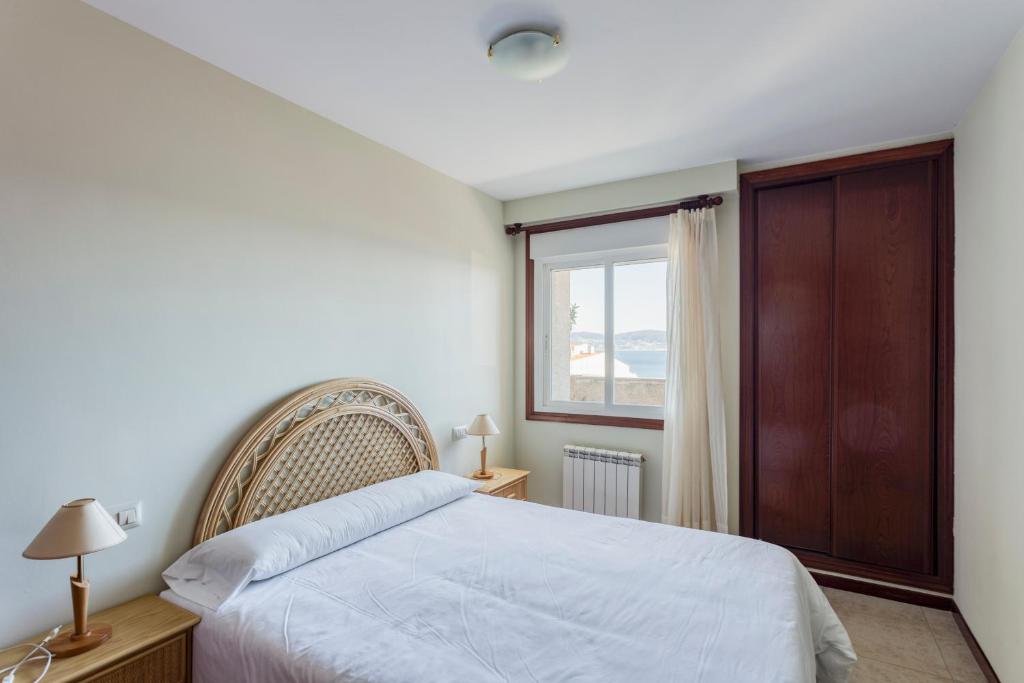 Postel nebo postele na pokoji v ubytování Apartamentos Granxola