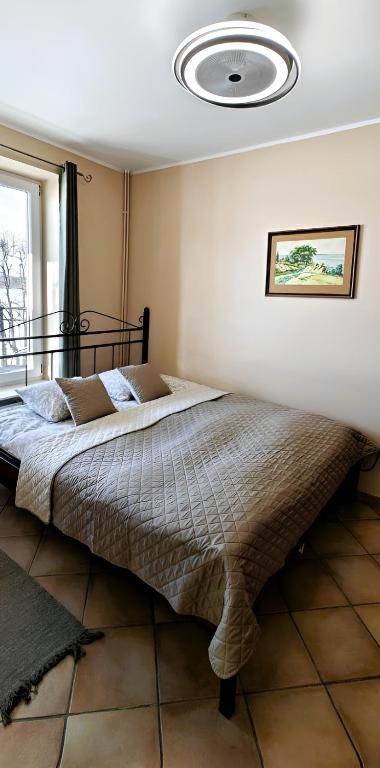 Posteľ alebo postele v izbe v ubytovaní Apartamenty Smętek