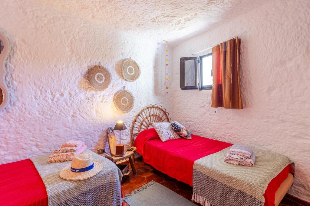 Postel nebo postele na pokoji v ubytování Finca Cuevas La Solana