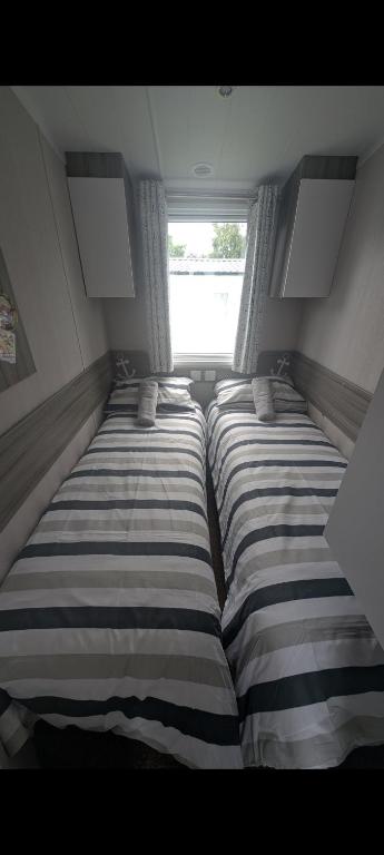 Postel nebo postele na pokoji v ubytování Caravan bliss