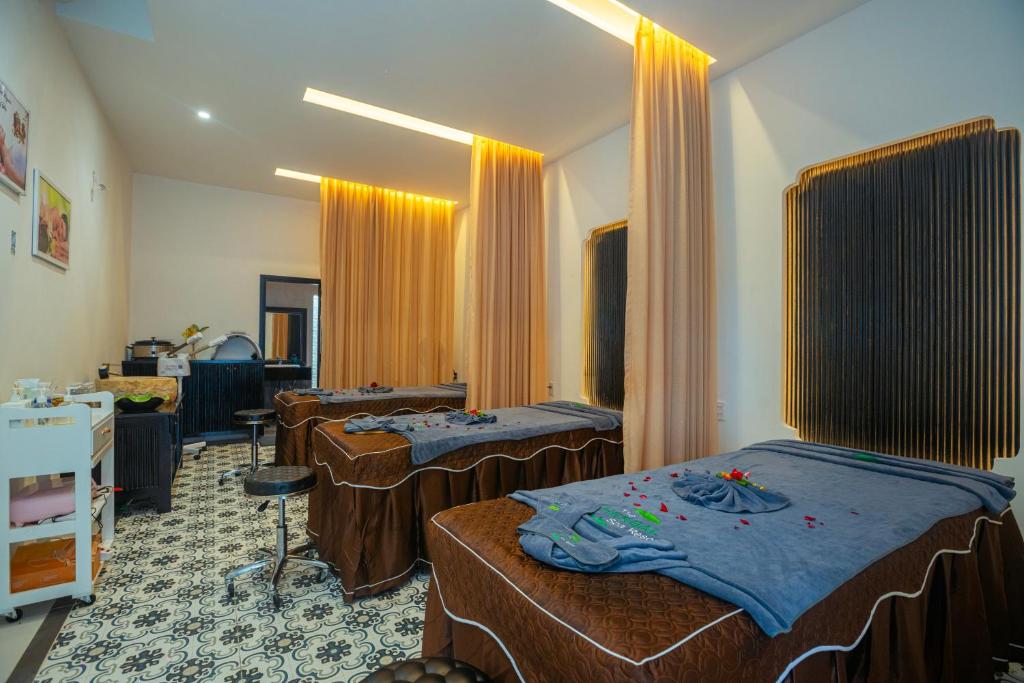 Giường trong phòng chung tại Herbal Resort & Spa