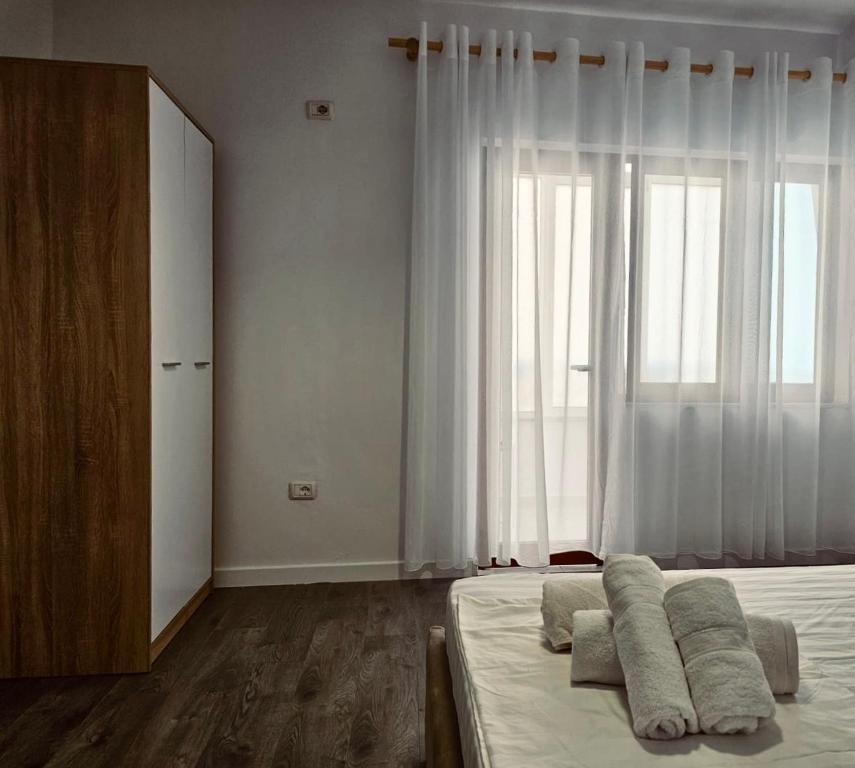 Voodi või voodid majutusasutuse Hi5 Rooms toas