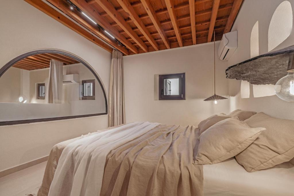 Postel nebo postele na pokoji v ubytování Noema Lindos - Athena Apartment