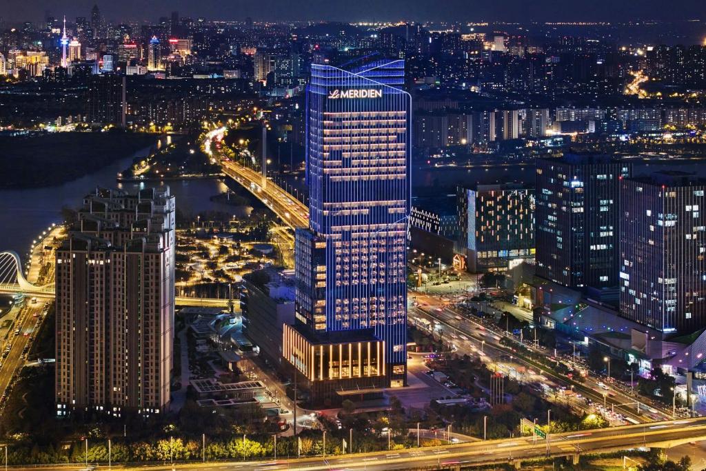 a view of a lit up city at night at Le Meridien Nantong in Nantong