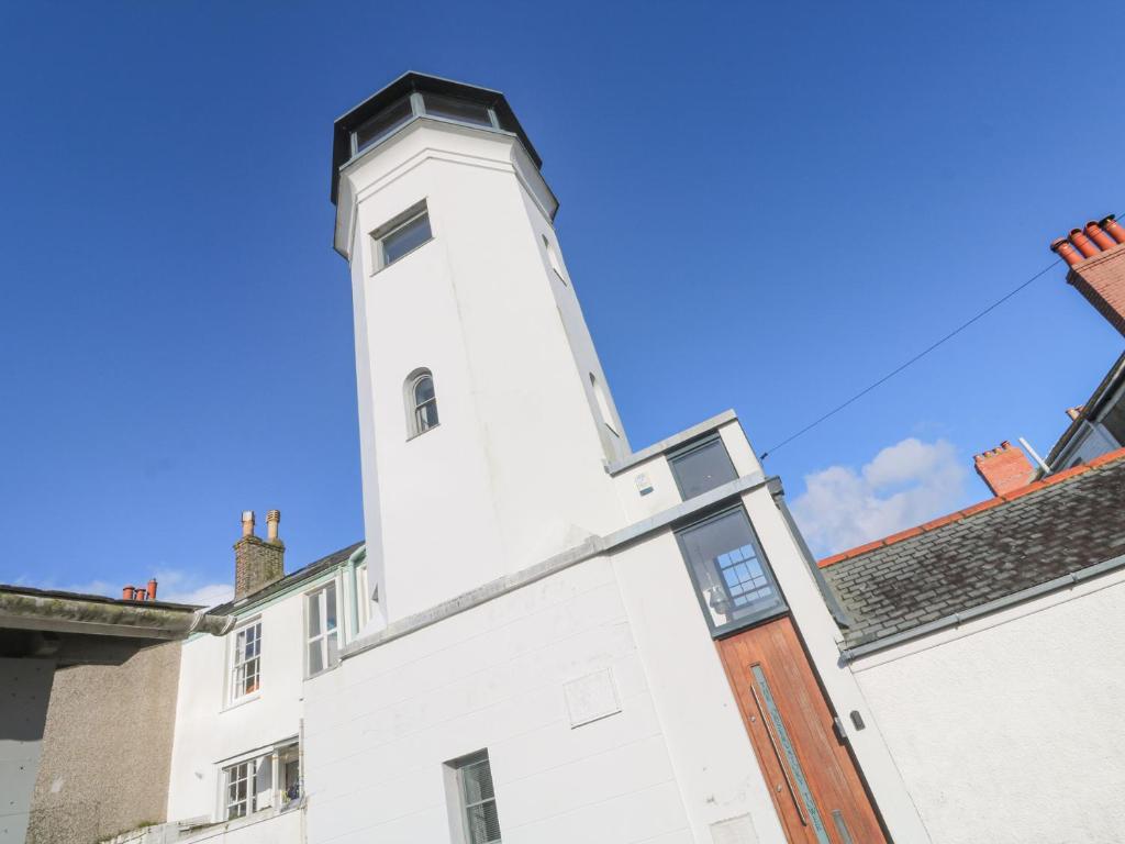 a white building with a tower on top of it at The Observatory Tower in Falmouth