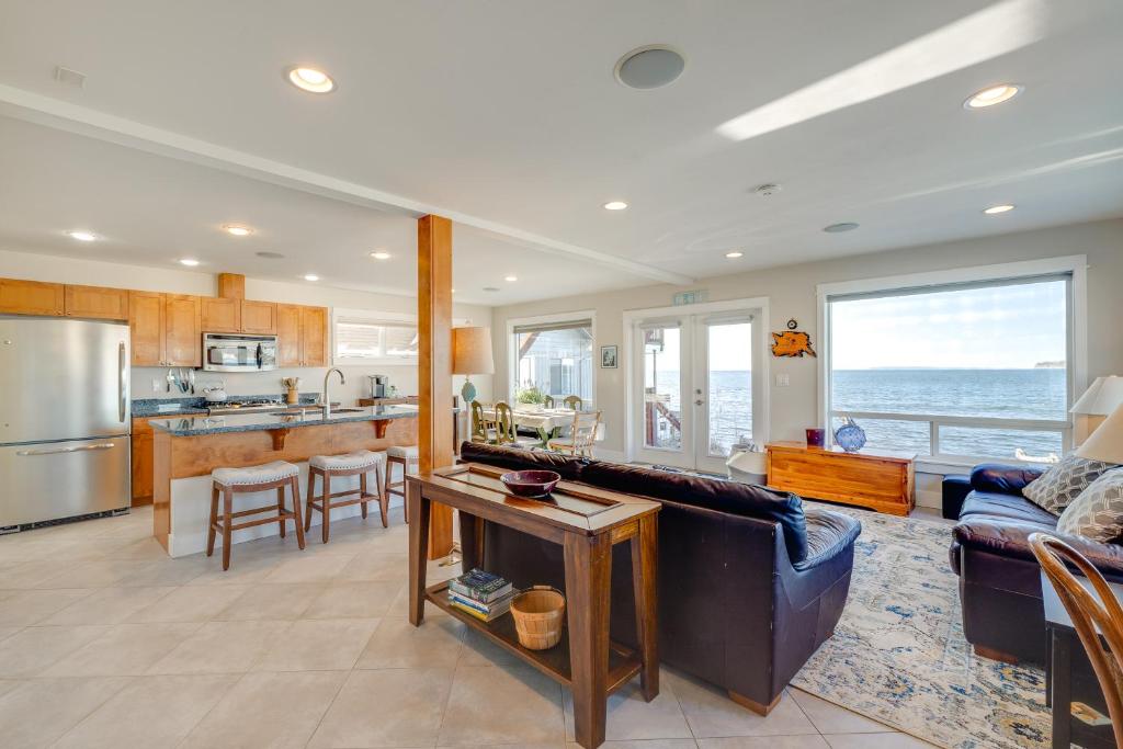 a living room with a couch and a kitchen at Ocean Views and Beach Access at Cottage on Birch Bay in Blaine