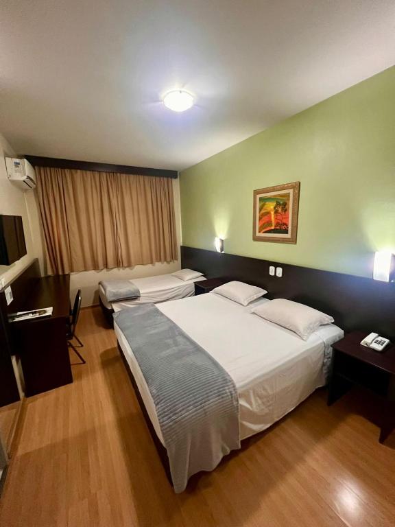 Postel nebo postele na pokoji v ubytování Dom Pedro I Palace Hotel