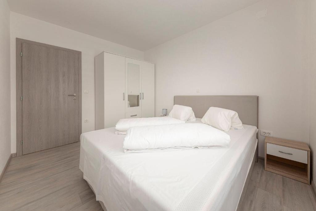 Postel nebo postele na pokoji v ubytování Perfect Place Apartments