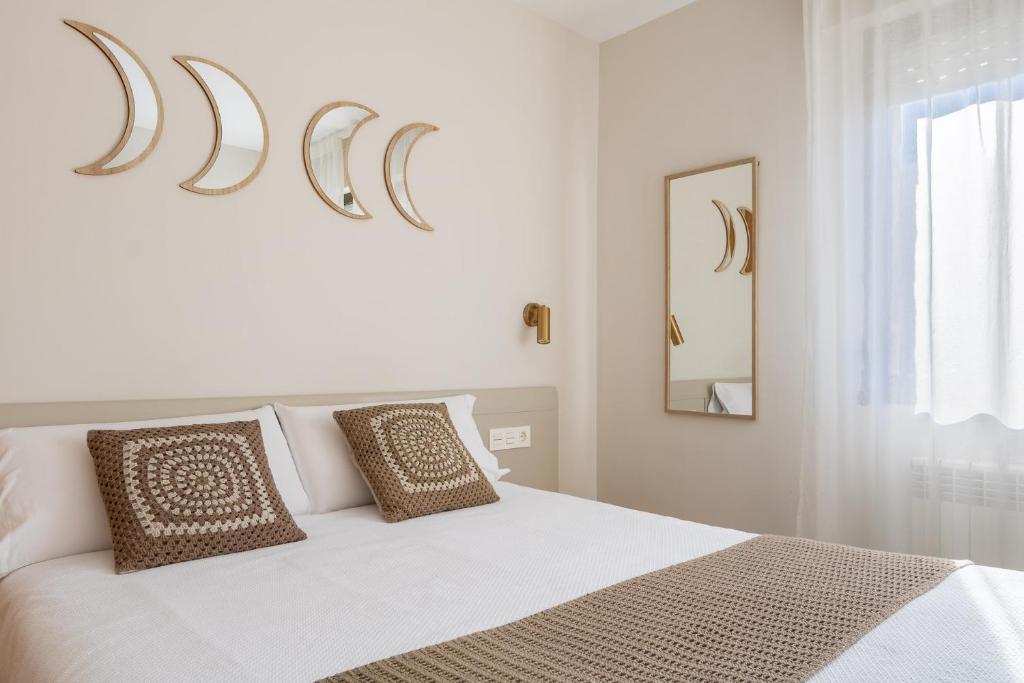 Postel nebo postele na pokoji v ubytování Hostal Lóbrega