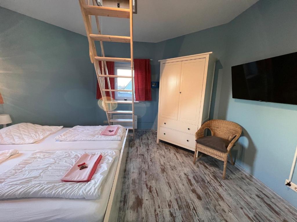 Postel nebo postele na pokoji v ubytování Ferienhaus Leuchtturm