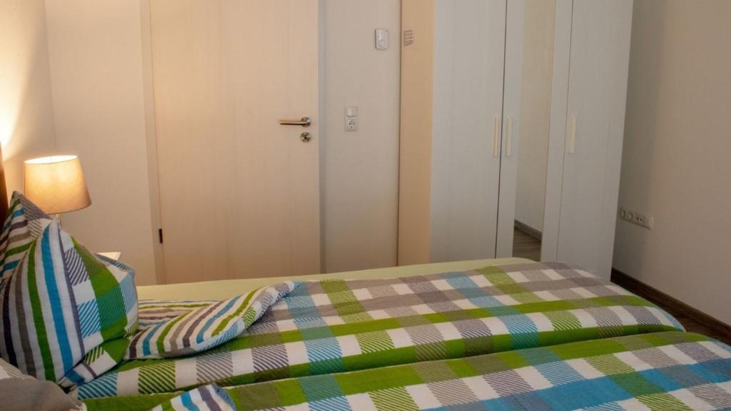 Postel nebo postele na pokoji v ubytování Ferienwohnung Gute Zeit - Apartment 2