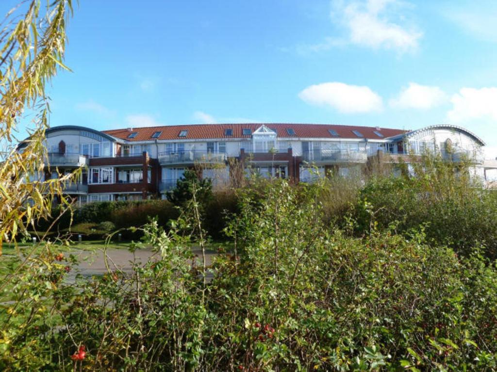 a large building with a lot of windows at de ebb in Dorum-Neufeld