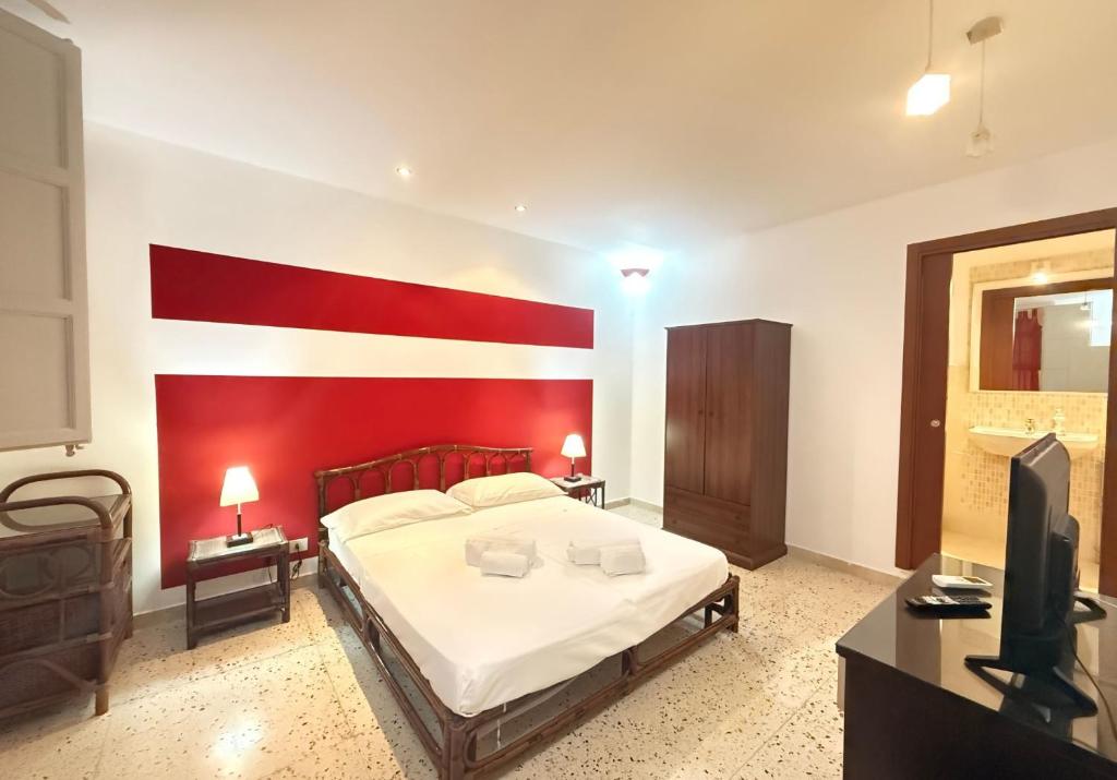 Łóżko lub łóżka w pokoju w obiekcie CasinadellePalme Appartamento in centro zona porto