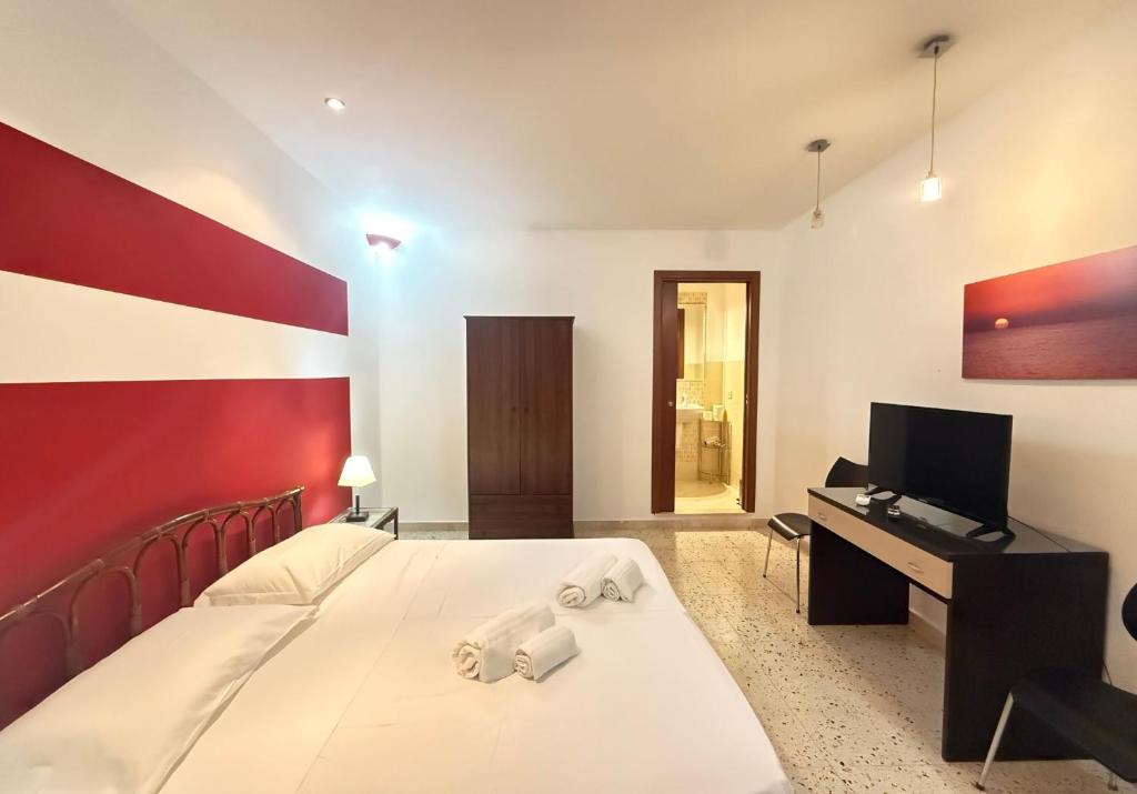 Telewizja i/lub zestaw kina domowego w obiekcie CasinadellePalme Appartamento in centro zona porto
