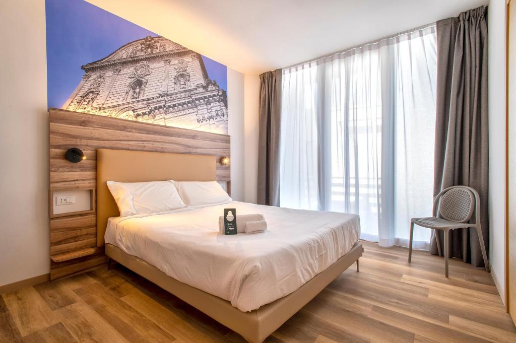 Postel nebo postele na pokoji v ubytování B&B HOTEL Sassari