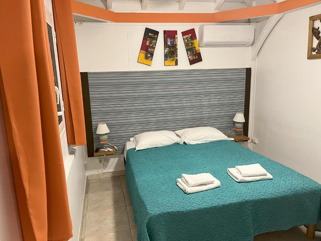 Postel nebo postele na pokoji v ubytování Résidence B&L Lagon : Bungalow Corail