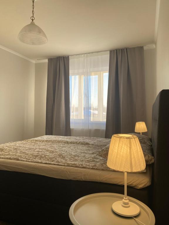 Ένα ή περισσότερα κρεβάτια σε δωμάτιο στο Otepää city view apartment