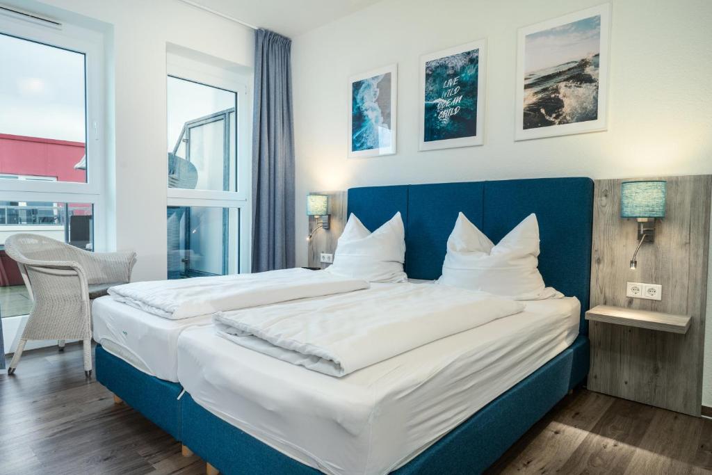 Postel nebo postele na pokoji v ubytování Residenz Bollwark 223