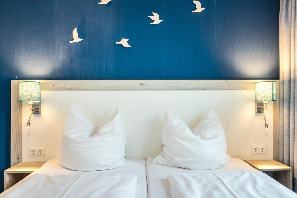 Postel nebo postele na pokoji v ubytování Residenz Bollwark 223
