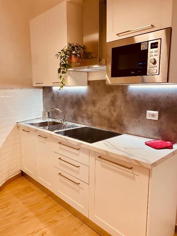 Kuchyň nebo kuchyňský kout v ubytování Porta a Piastri Apartment