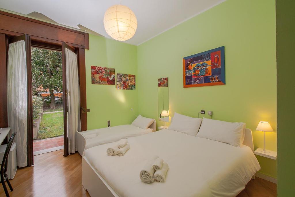 Postel nebo postele na pokoji v ubytování Villa Paradis B&B